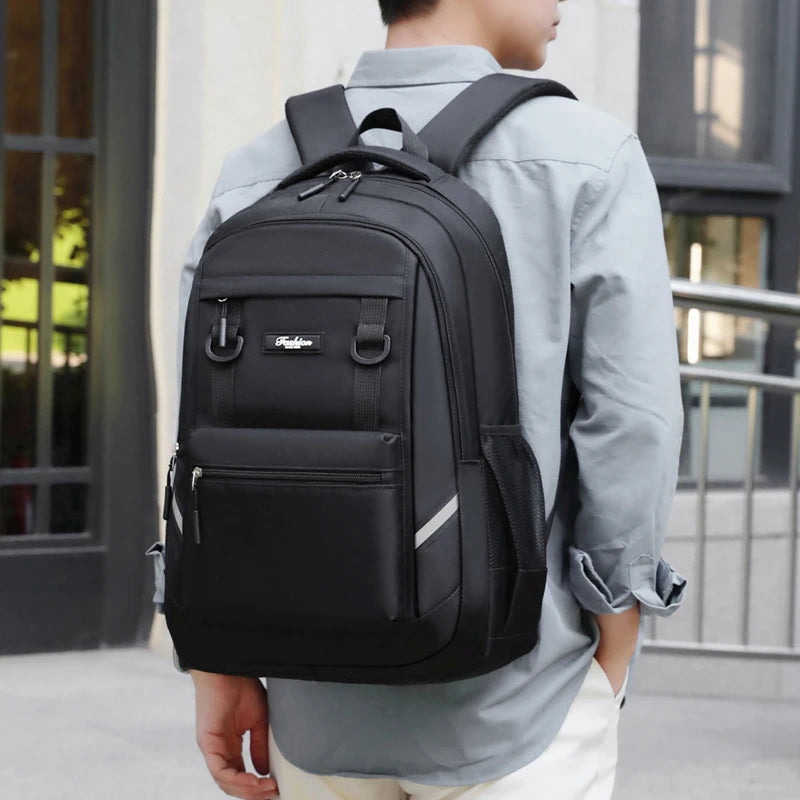 Stylish large-capacity backpack with multiple pockets, equipped with a laptop compartment and adjustable shoulder straps, perfec